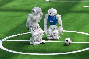 Robots fight for the ball during their football match in the standard platform league tournament at the RoboCup 2017 in Nagoya, Aichi prefecture on July 30, 2017