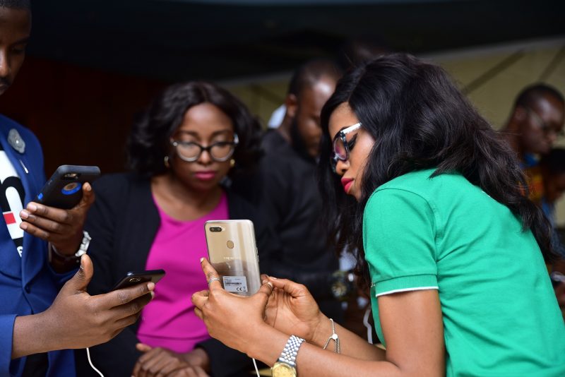 Guest examining the OPPO A1K and A5s at the launch today 2.