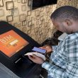 A bitcoin user checks the receipts after buying bitcoins with naira on Bitcoin Teller Machine in Lagos, Nigeria September 1, 2020. Picture taken September 1, 2020. REUTERS/Seun Sanni