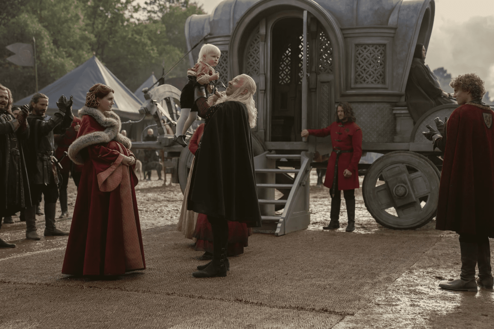 King Viserys holding his son Aegon Targaryen - House of the Dragon episode 3